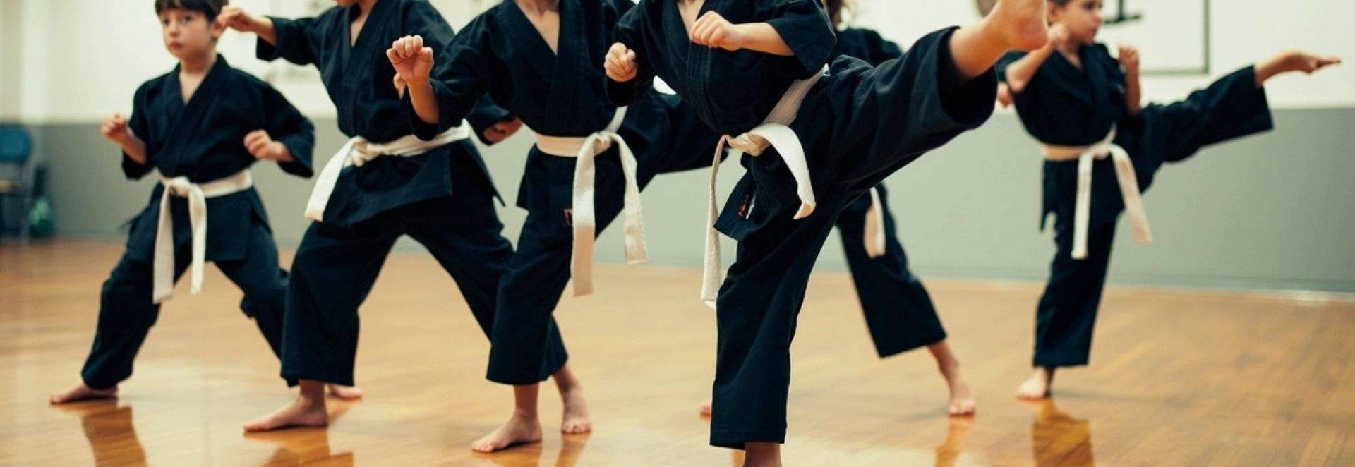 kids kicking in karate class
